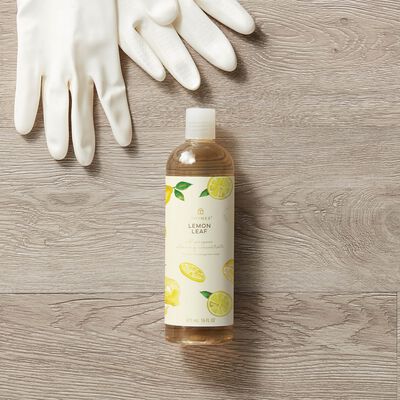 Thymes Lemon Leaf All Purpose Cleaning Concentrate to Clean and Freshen Your Home on top of sponges and bubbles